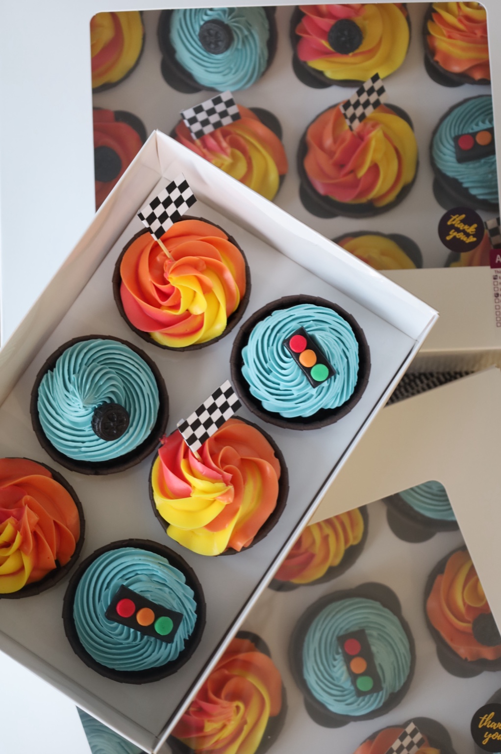 Blue decorated cupcakes in a gift box