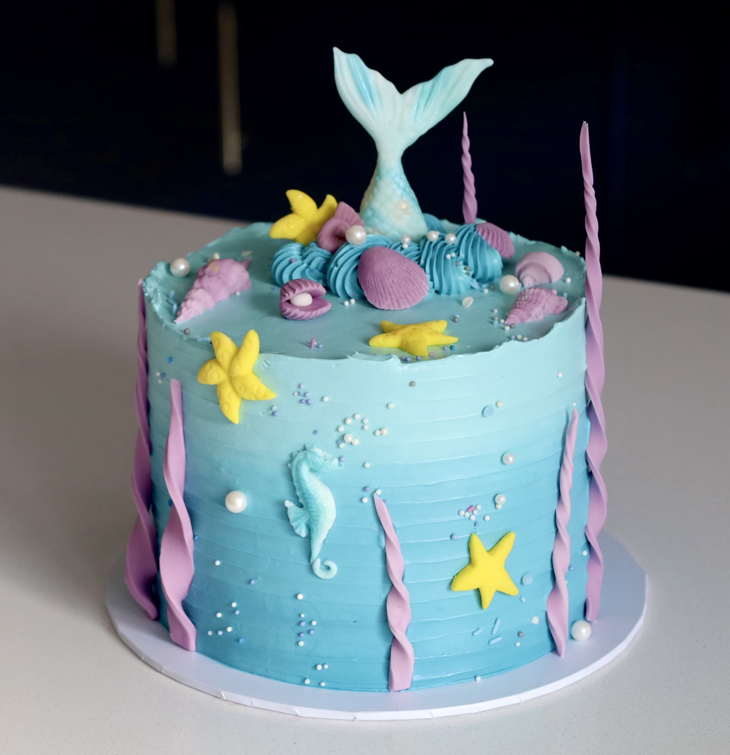 Blue mermaid-themed celebration cake
