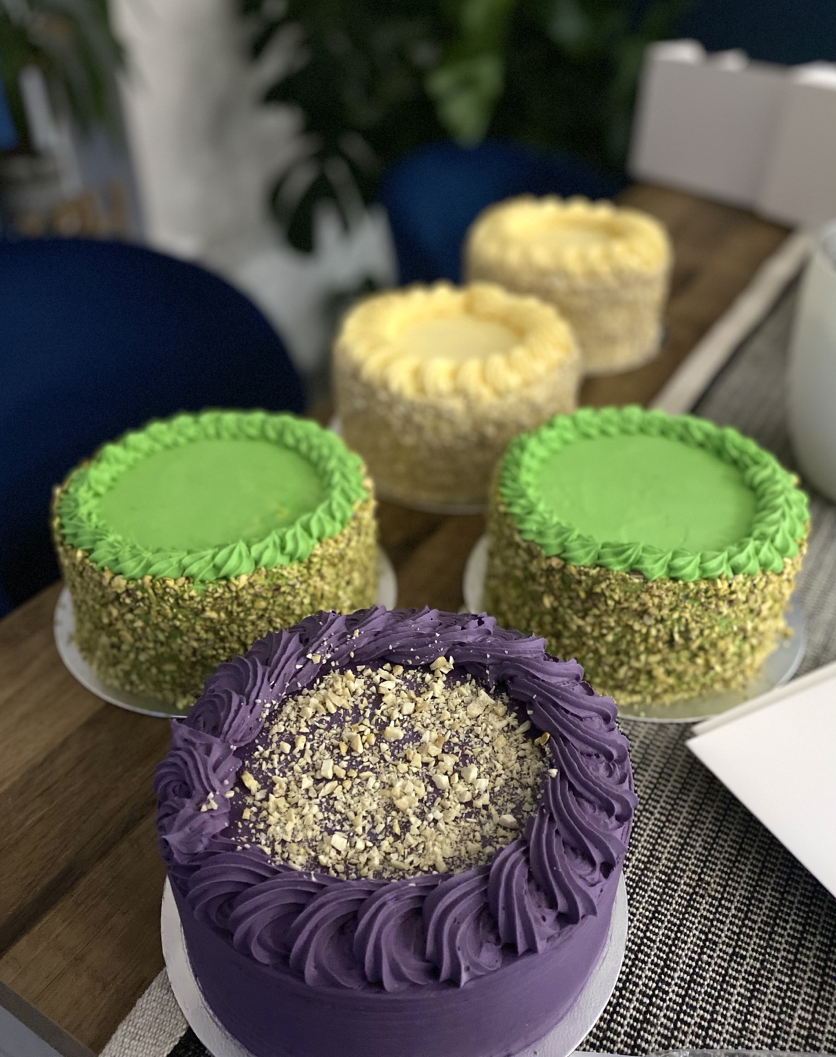 Assorted Sans Rival cakes in ube, pistachio and classic flavours