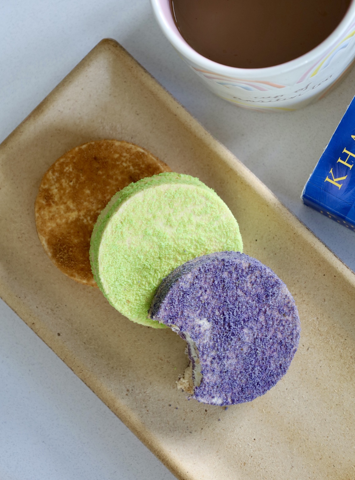 Classic, pistachio and ube Silvanas with coffee
